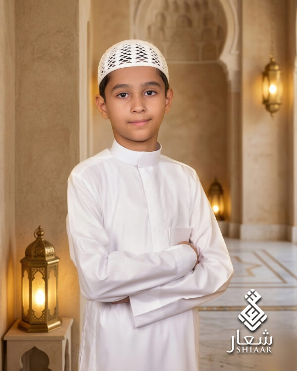 Boy wearing a SHIAAR white thobe